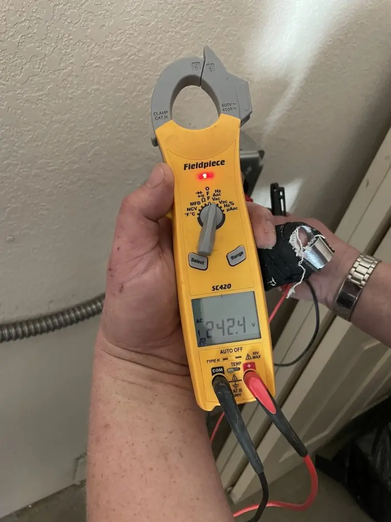 Voltage testing with clamp meter during Ceiling Fan Installation in Valley